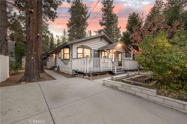 2028 Manzanita Ln, Big Bear City, CA 92314 - view of front of property featuring driveway, covered porch, and crawl space