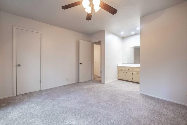 2028 Manzanita Ln, Big Bear City, CA 92314 - unfurnished bedroom featuring light colored carpet, ensuite bath, ceiling fan, and recessed lighting