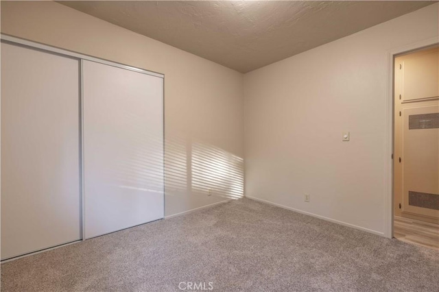 2028 Manzanita Ln, Big Bear City, CA 92314 - unfurnished bedroom featuring carpet floors and a closet