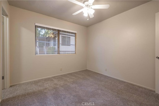 empty room featuring carpet flooring and ceiling fan