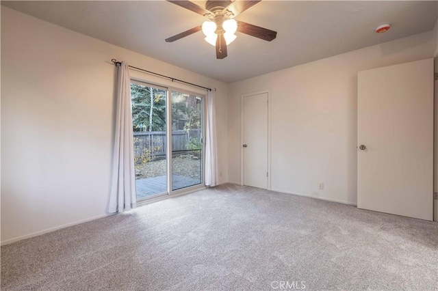 carpeted empty room with ceiling fan