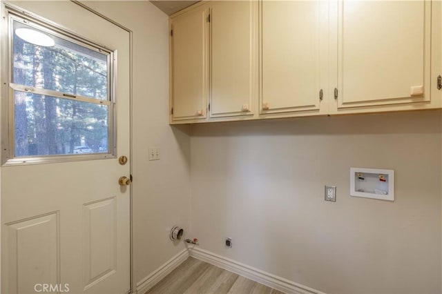 2028 Manzanita Ln, Big Bear City, CA 92314 - washroom with hookup for a washing machine, light wood-style flooring, cabinet space, and gas dryer hookup