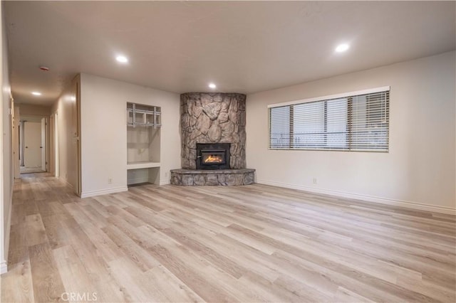 2028 Manzanita Ln, Big Bear City, CA 92314 - unfurnished living room with light wood finished floors, a fireplace, and recessed lighting