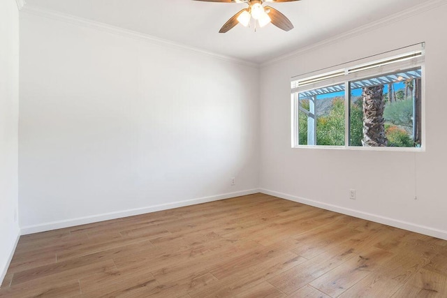 empty room with ceiling fan, ornamental molding, and light hardwood / wood-style flooring