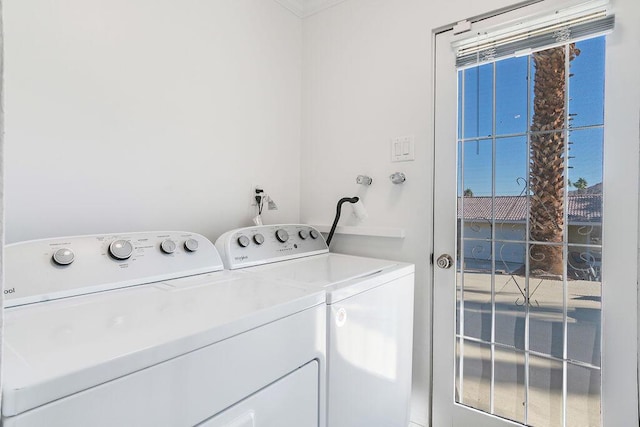 washroom with washing machine and clothes dryer