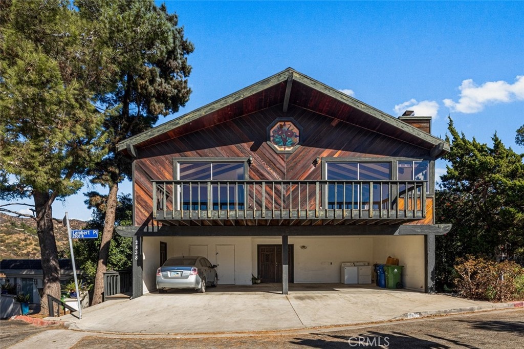 view of front of property with a carport