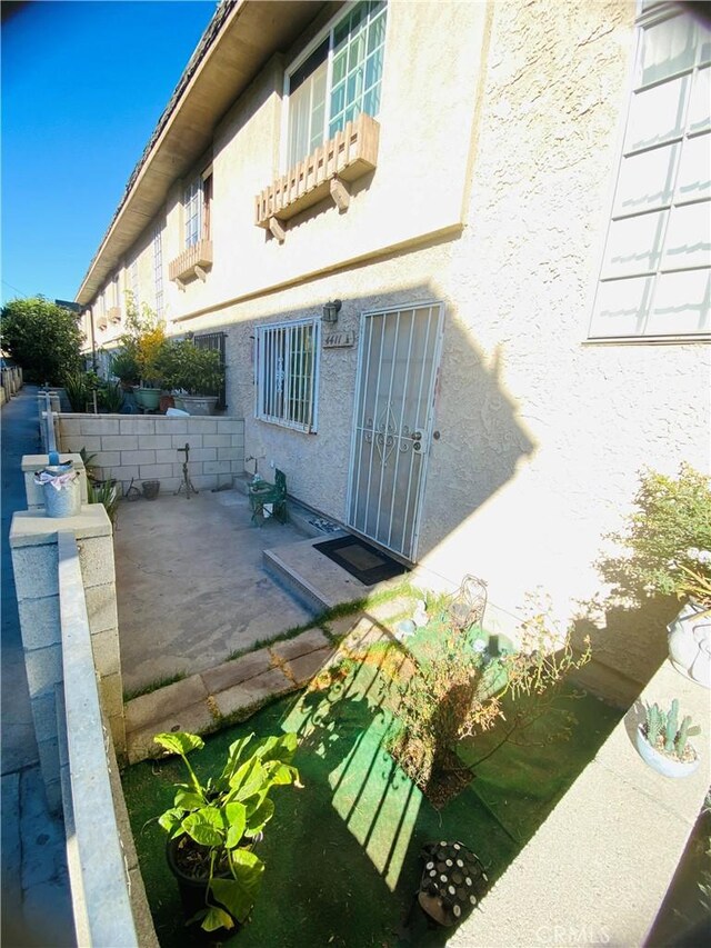 view of side of property featuring a patio