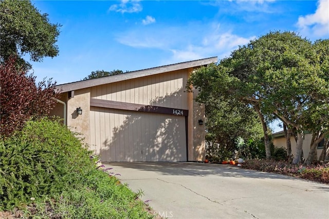 view of side of property featuring a garage