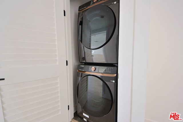 washroom with stacked washer and clothes dryer