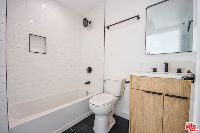 full bathroom with toilet, vanity, tile patterned floors, and tiled shower / bath