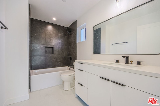 full bathroom with vanity, tile patterned floors, tiled shower / bath combo, and toilet