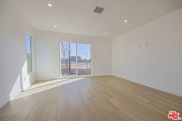 spare room with light wood-type flooring