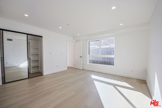 unfurnished bedroom featuring light hardwood / wood-style floors