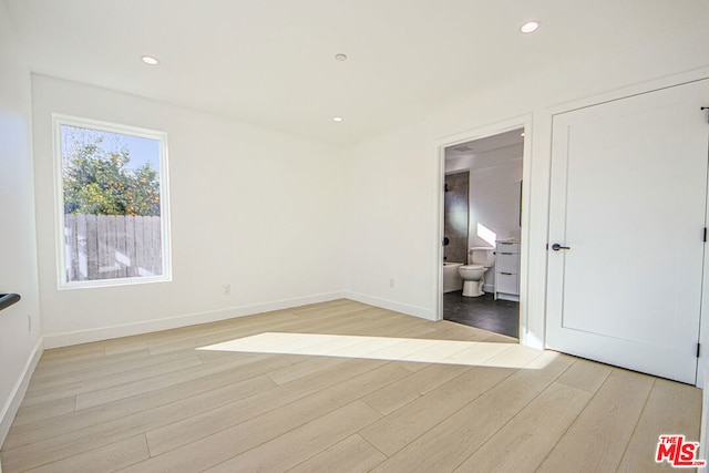 spare room featuring light hardwood / wood-style floors