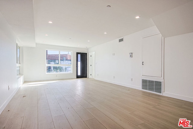 unfurnished room featuring light wood-type flooring