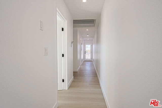 hall with light wood-type flooring