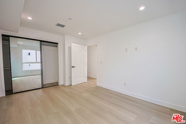 unfurnished bedroom featuring light hardwood / wood-style flooring