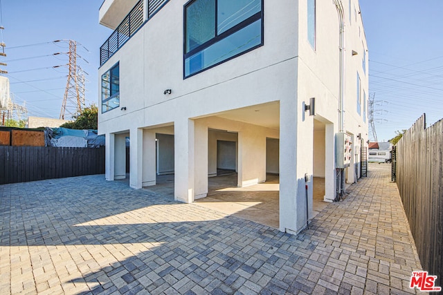 rear view of house with a patio