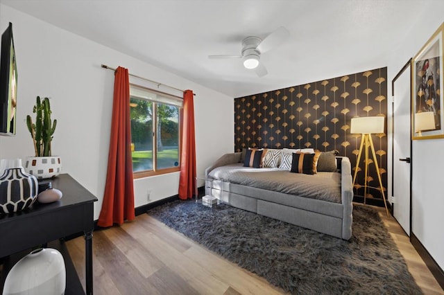 bedroom featuring ceiling fan and wood-type flooring