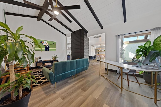 living room with light wood-type flooring, a brick fireplace, ceiling fan, beam ceiling, and high vaulted ceiling