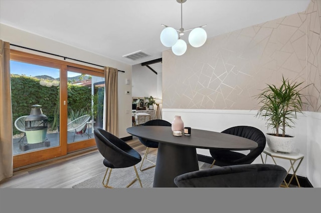 dining room with light hardwood / wood-style flooring