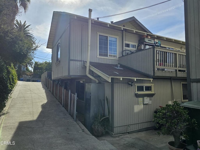 view of side of property featuring a balcony