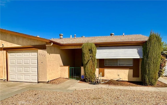 ranch-style home with a garage