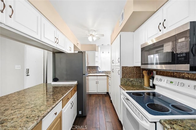 kitchen featuring white cabinets, ceiling fan, dark hardwood / wood-style flooring, and appliances with stainless steel finishes