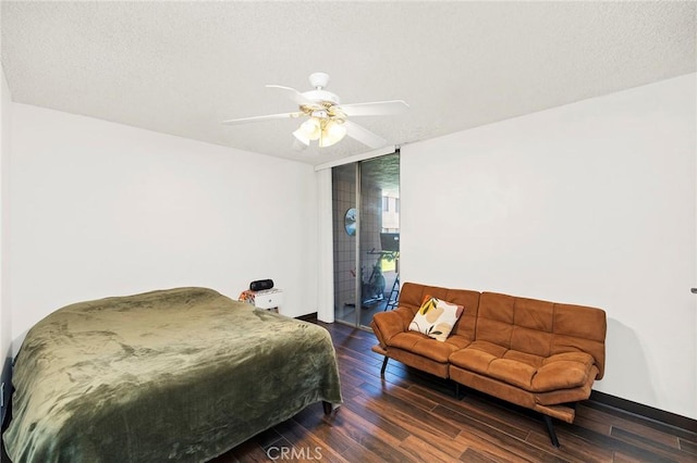 bedroom with access to outside, ceiling fan, a textured ceiling, and dark hardwood / wood-style floors