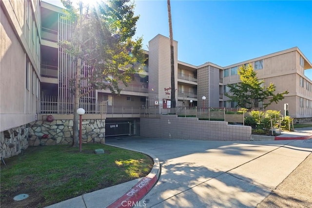 view of property's community with a lawn