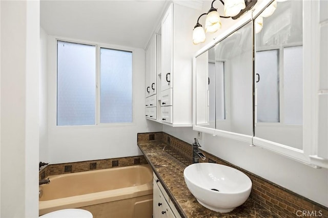 bathroom with a bathtub and vanity