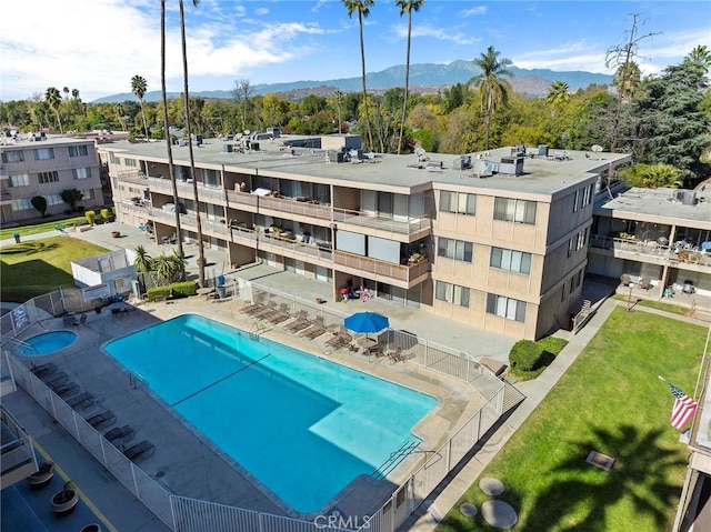 view of swimming pool with a mountain view