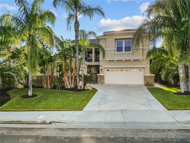 view of front of house featuring a front yard and a garage