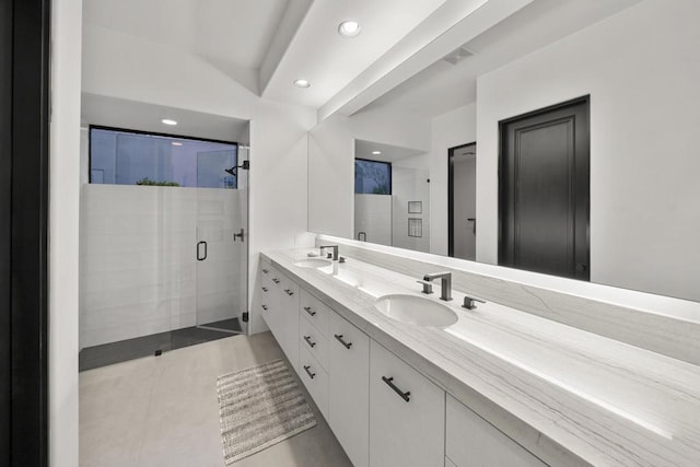 bathroom featuring vanity, tile patterned floors, and a shower with door