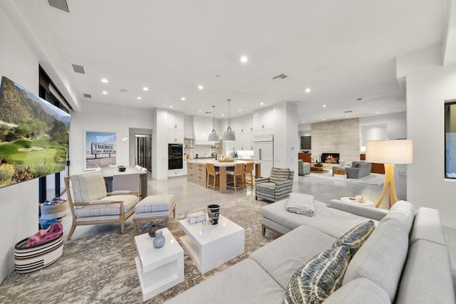 living room with a large fireplace