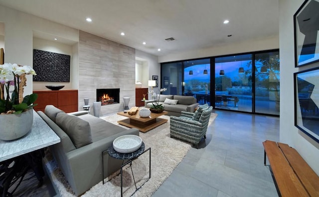 living room featuring a large fireplace