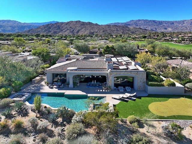 exterior space featuring a patio area and a mountain view