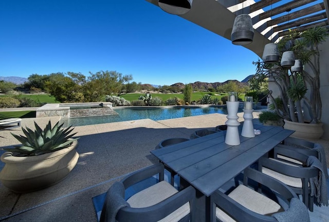 view of pool with an in ground hot tub and a patio