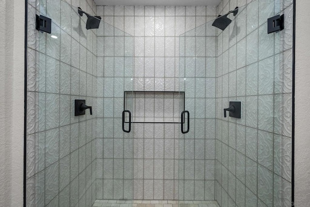 bathroom with a shower with shower door