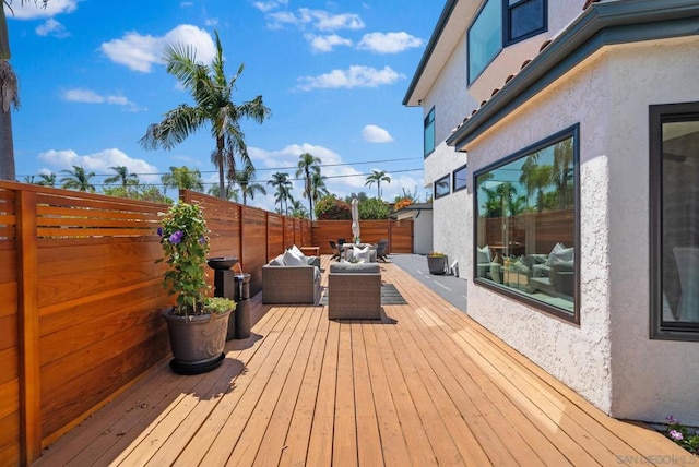 wooden deck with outdoor lounge area