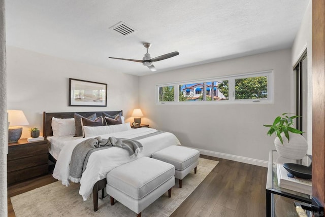 bedroom with ceiling fan and hardwood / wood-style floors