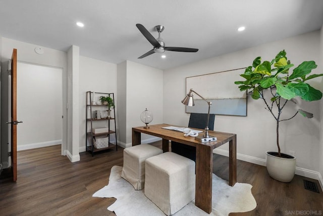 home office with ceiling fan and dark hardwood / wood-style floors