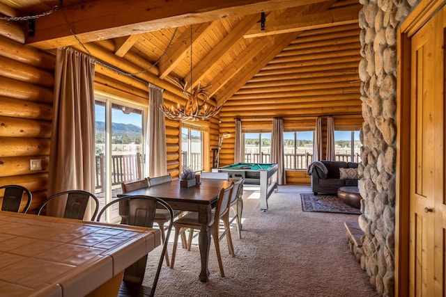 carpeted dining area featuring a mountain view, a wealth of natural light, rustic walls, and billiards