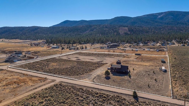 bird's eye view featuring a mountain view and a rural view