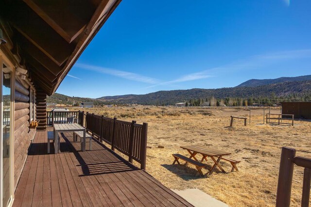 wooden terrace with a mountain view