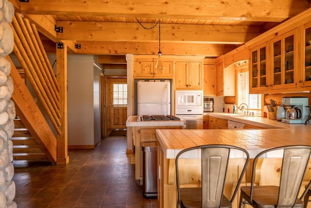 kitchen with kitchen peninsula, white appliances, decorative light fixtures, and wooden ceiling