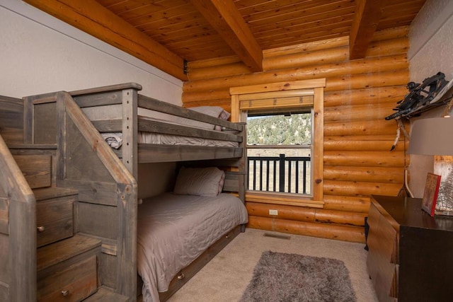 bedroom featuring log walls, beam ceiling, and wooden ceiling