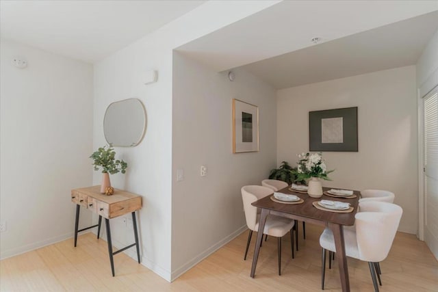 dining area featuring light wood-type flooring