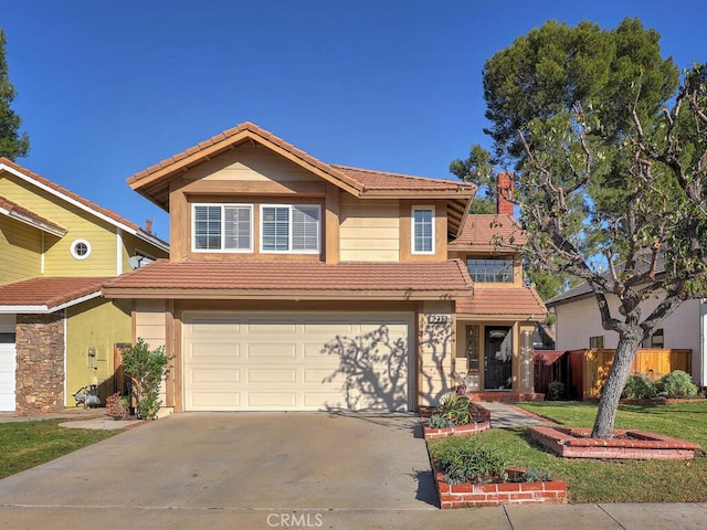 front of property with a garage and a front yard