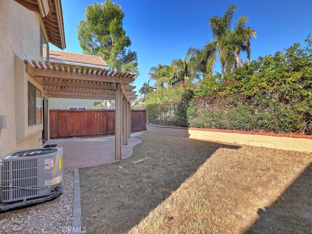 view of yard featuring a pergola, cooling unit, and a patio